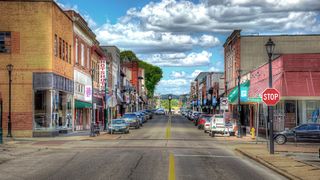 brick-faced buildings line a small town street